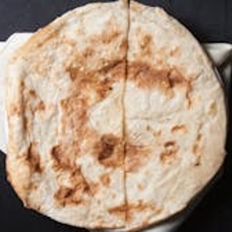 Freshly Baked Naan: A Flavorful Addition
