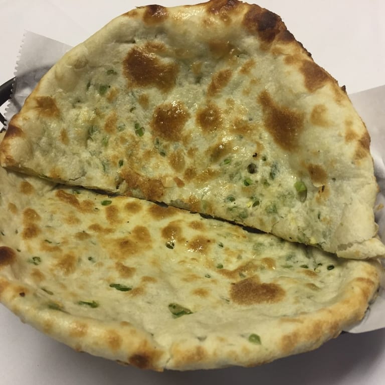 Freshly Baked Naan: A Flavorful Addition