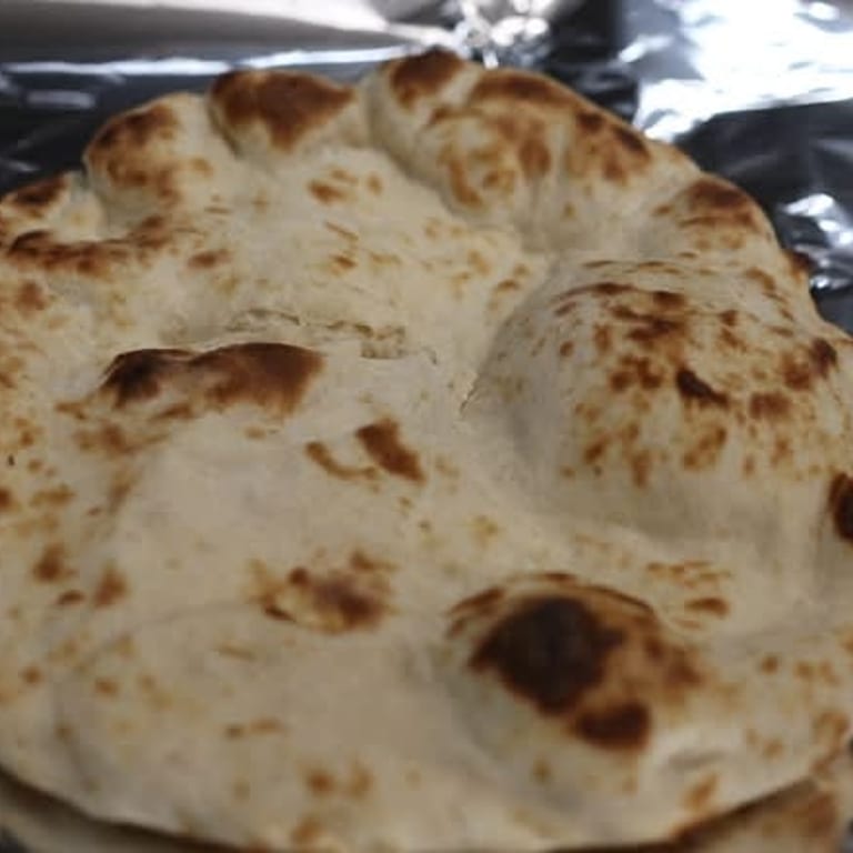 Freshly Baked Naan: A Flavorful Addition
